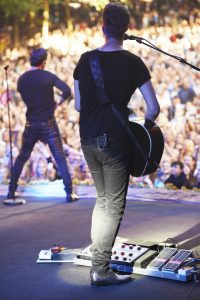 Guitarist performing on stage at a music concerthttp://195.154.178.81/DATA/i_collage/pi/shoots/782675.jpg